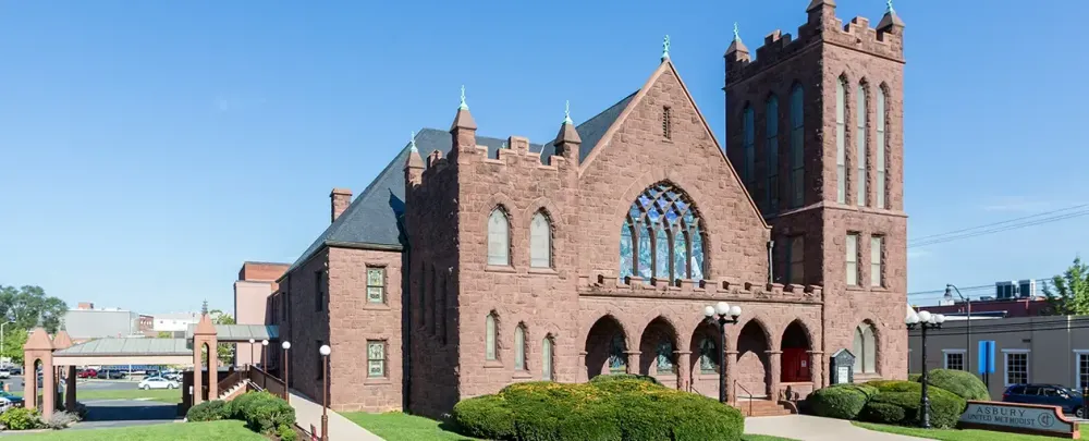 Asbury United Methodist Church architecture building travel church outdoors old sky ancient religion tower Gothic brick city traditional goth like abbey facade castle house