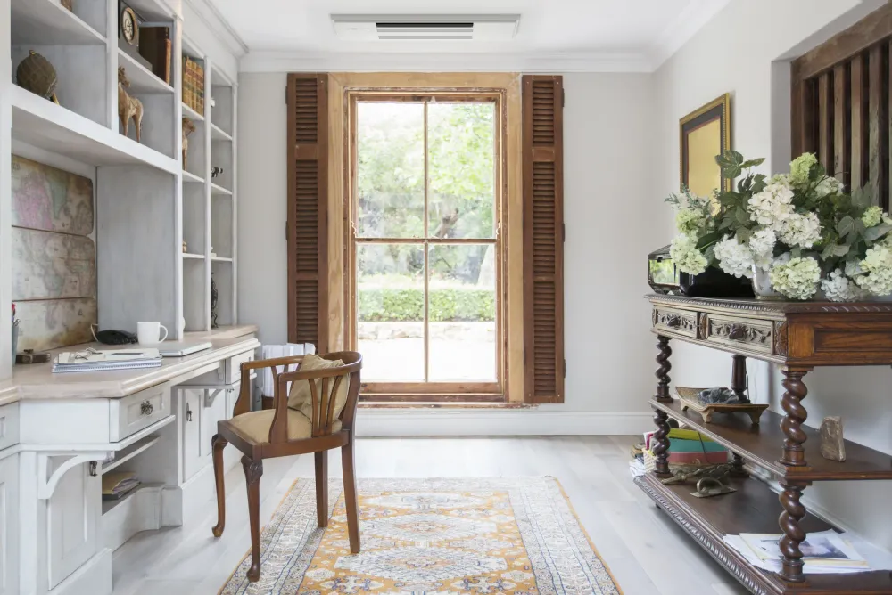 converted room with reading area and office space with mitsubishi electric mini split heat pump recessed ceiling cassette unit