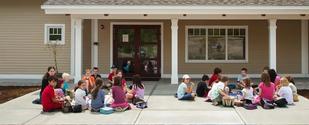 Hollis Montessori School child family class people group home education house girl woman man school porch boy teacher four group together son room recreation