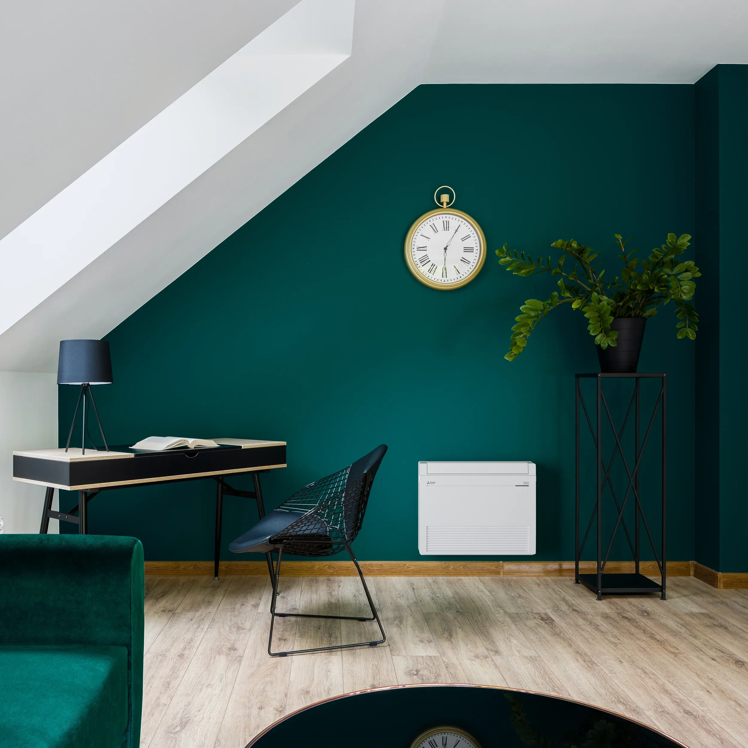 finished attic room or office area with mitsubishi electric mini split heat pump low-wall floor-mount unit