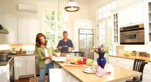 What to Know About SEER When Choosing An HVAC System stove family indoors room house cooking oven refrigerator counter home togetherness kitchenware home appliance preparation woman microwave dining room table dining