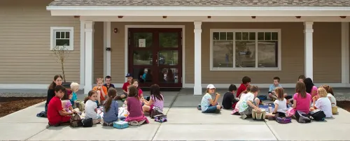 Hollis Montessori School child family class people group home education house girl woman man school porch boy teacher four group together son room recreation